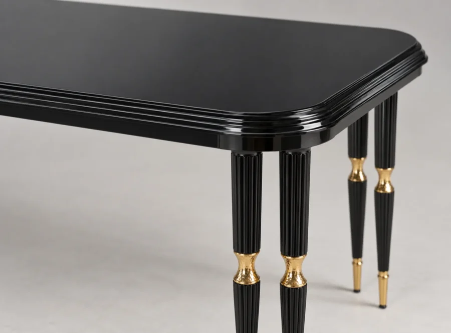 monaco-black-dining-table-3 Monaco Black Dining Table with Gold Accents, styled image, black tabletop edge and gold-accented leg close-up