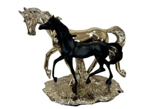 gold horse with black colt running