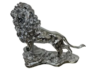 Silver lion on rocks