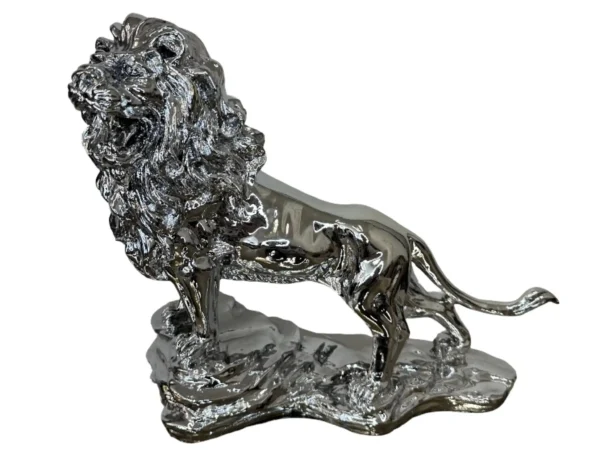 Silver lion on rocks
