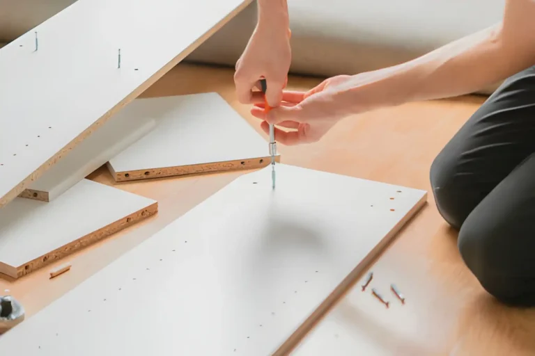 man assembling newly bought furniture