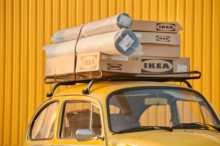 flat packed ikea sofa on top of taxi